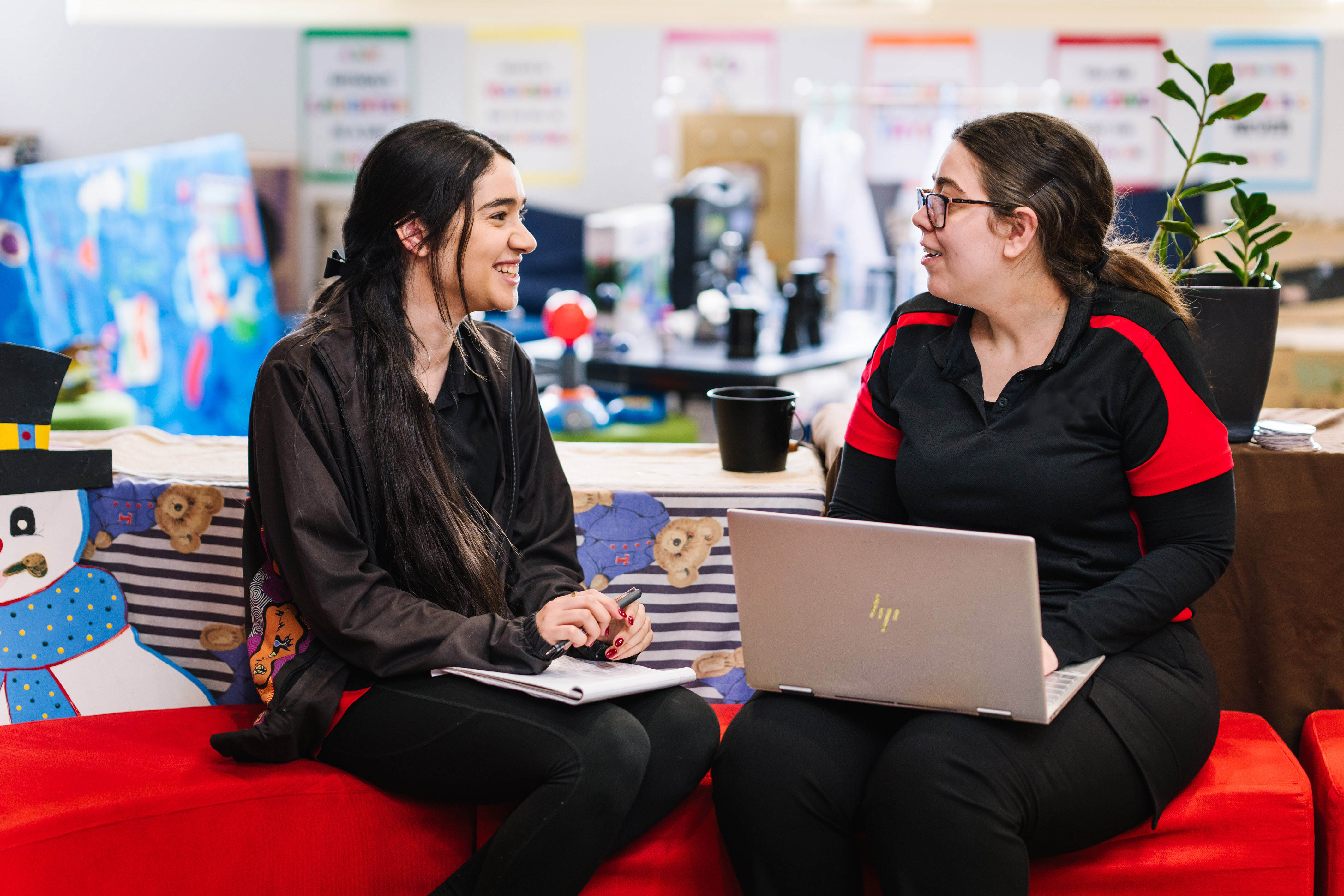 Educator and IP working together on laptop