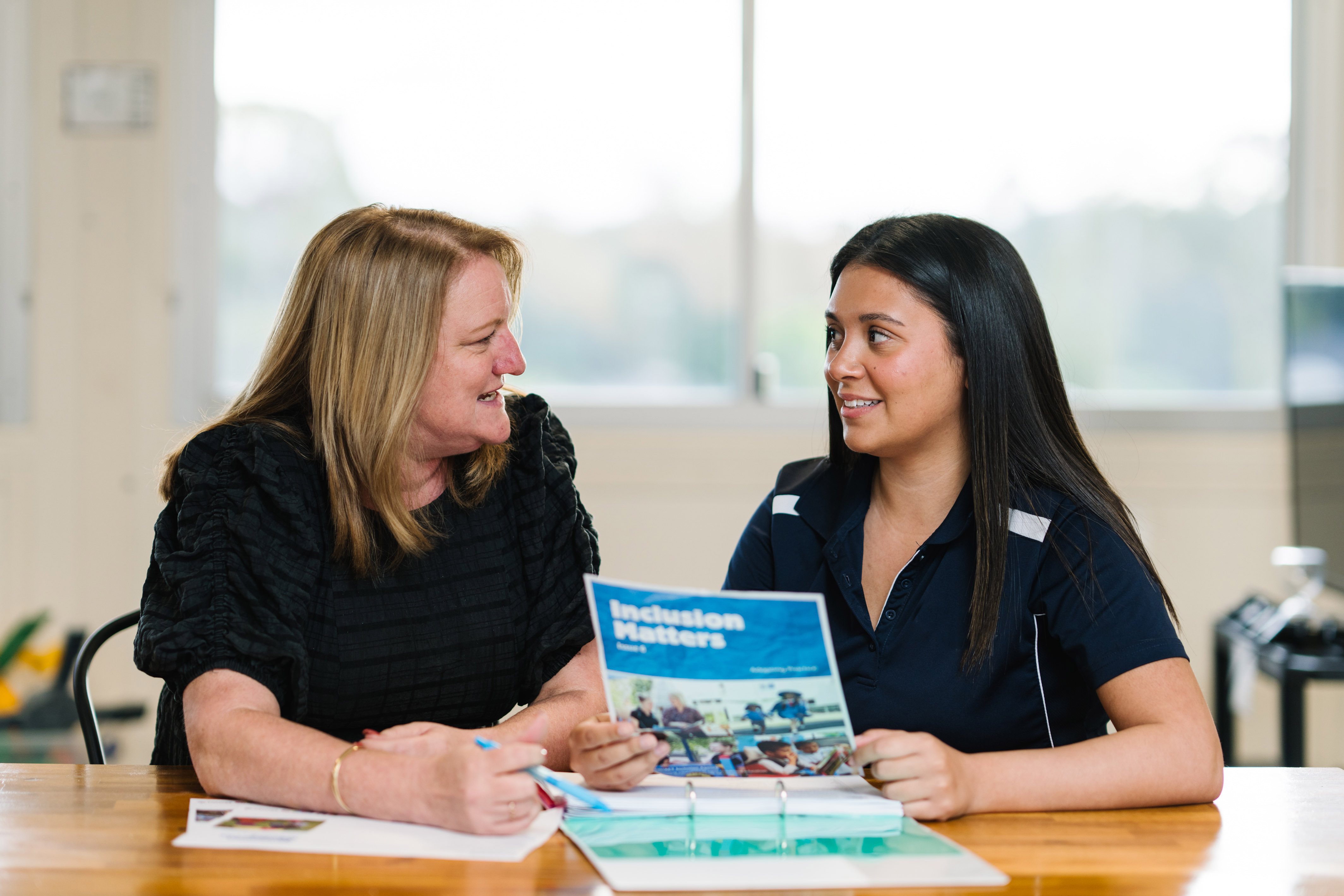 Inclusion Professional and educator talking